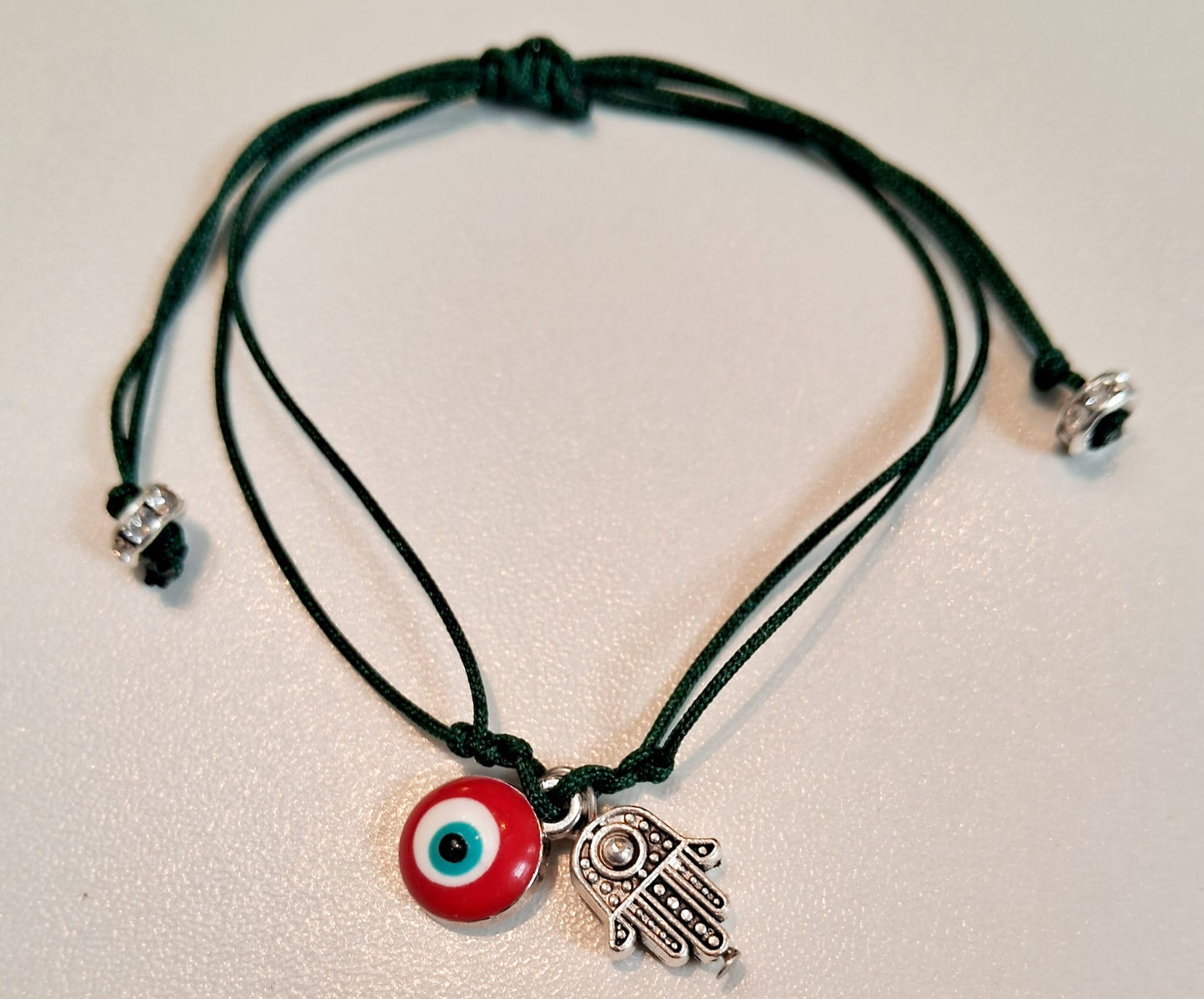 Pulsera de hilo con amuleto Hamsa y ojo turco